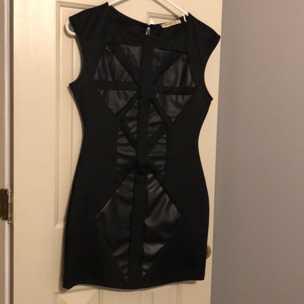 Black mini dress with leather abstract.